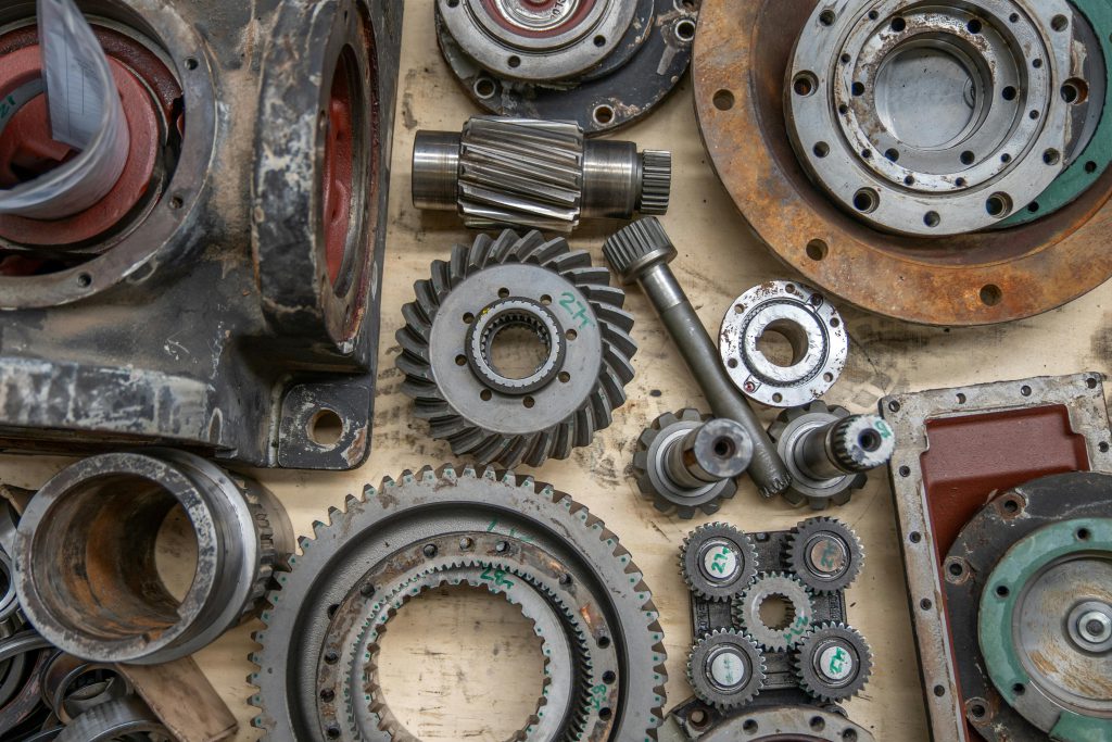 pexels-photo-28752152-28752152 Detailed shot of industrial gears and mechanical parts in a workshop setting.